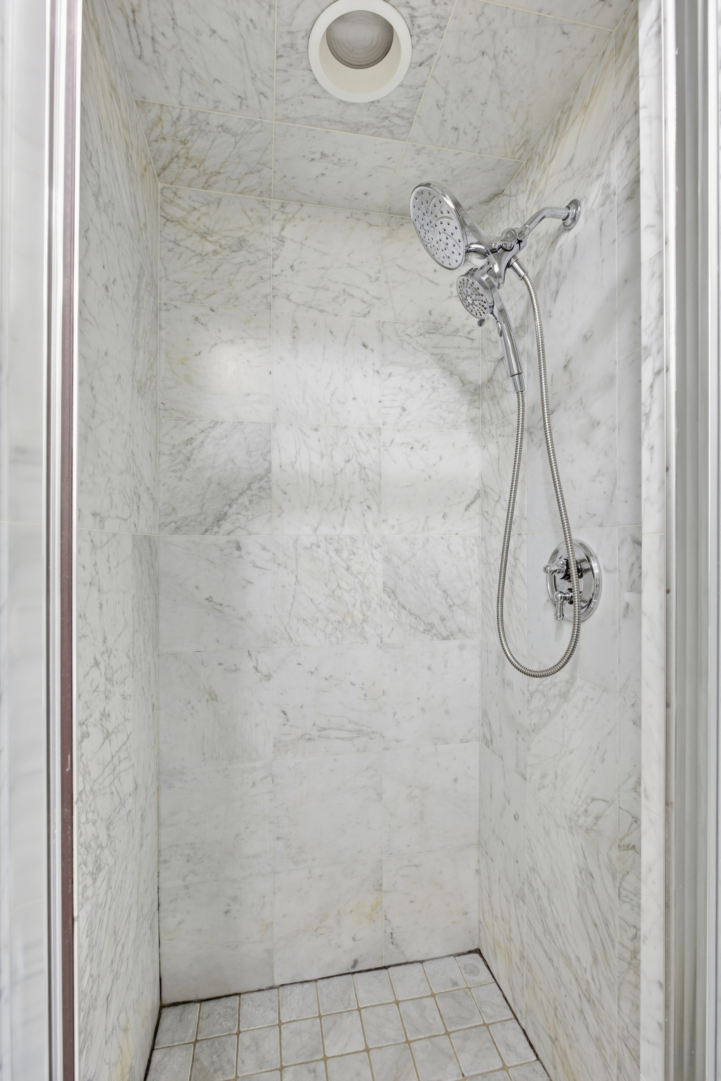 392 11th Street, Unit 3A Brooklyn, NY 11215 - Photo 10 of 11 a bathroom with a glass shower door