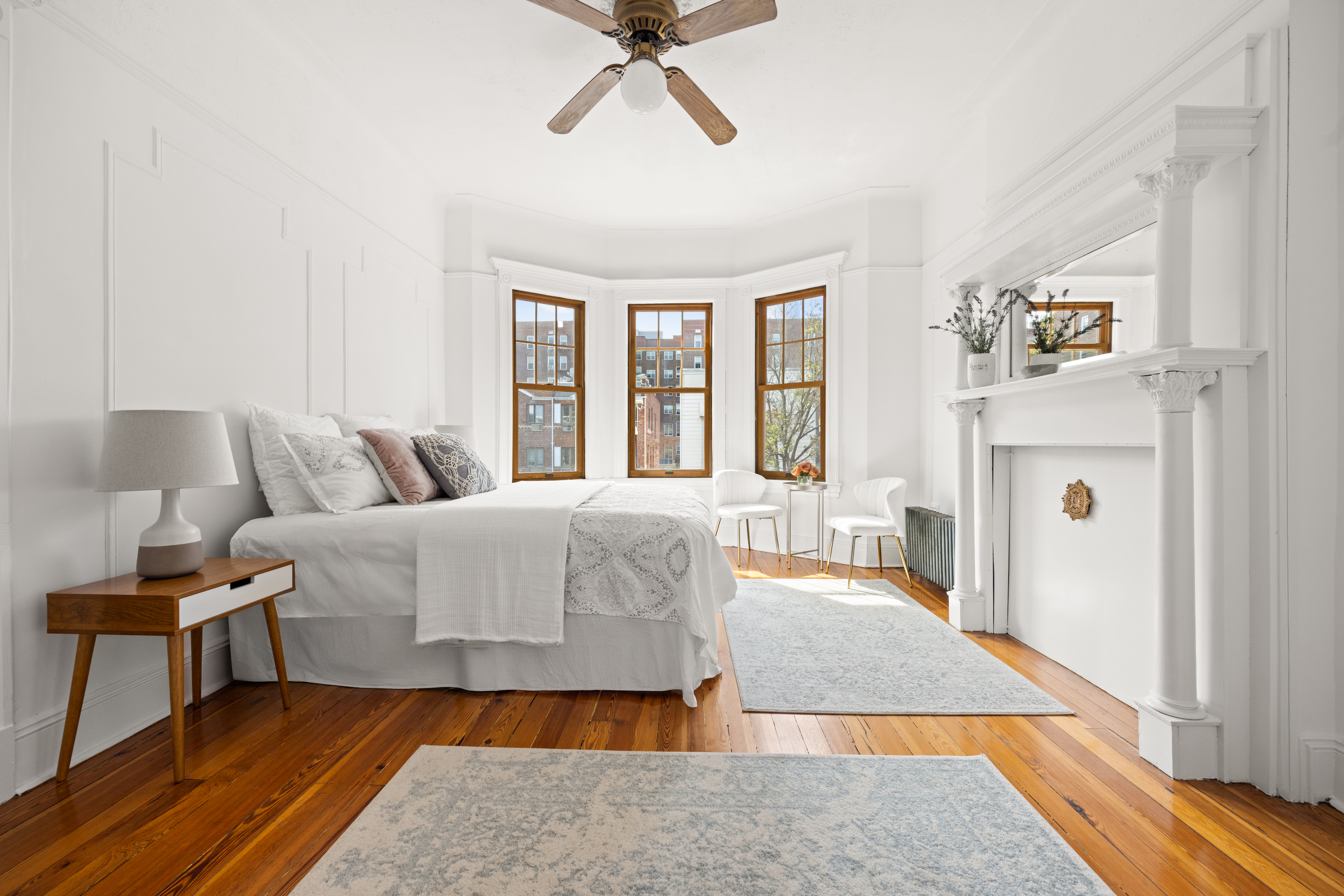 99 East 2nd Street Brooklyn, NY 11218 - Photo 12 of 24 a bedroom with a bed and wooden floor