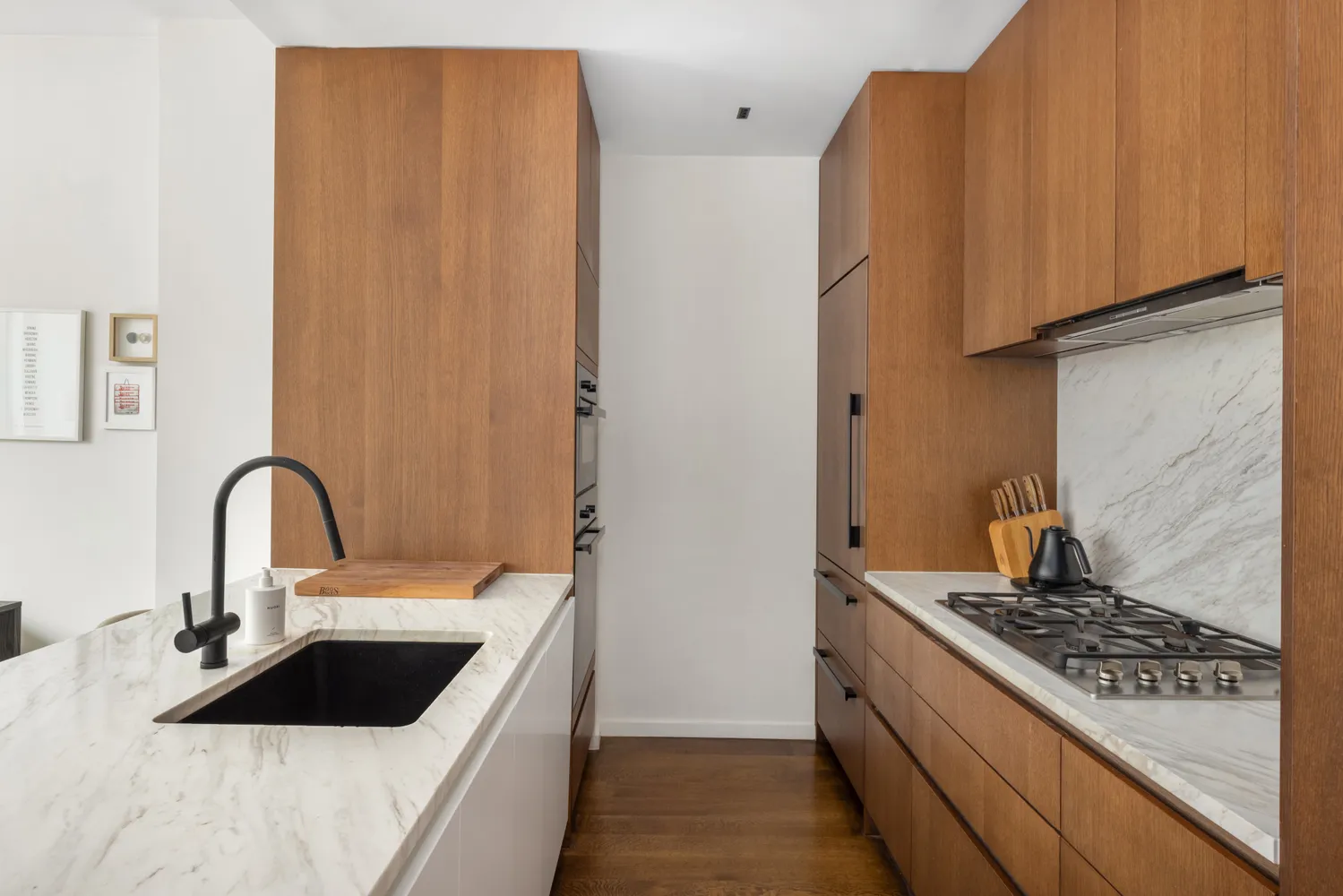a kitchen with a sink and a stove top oven