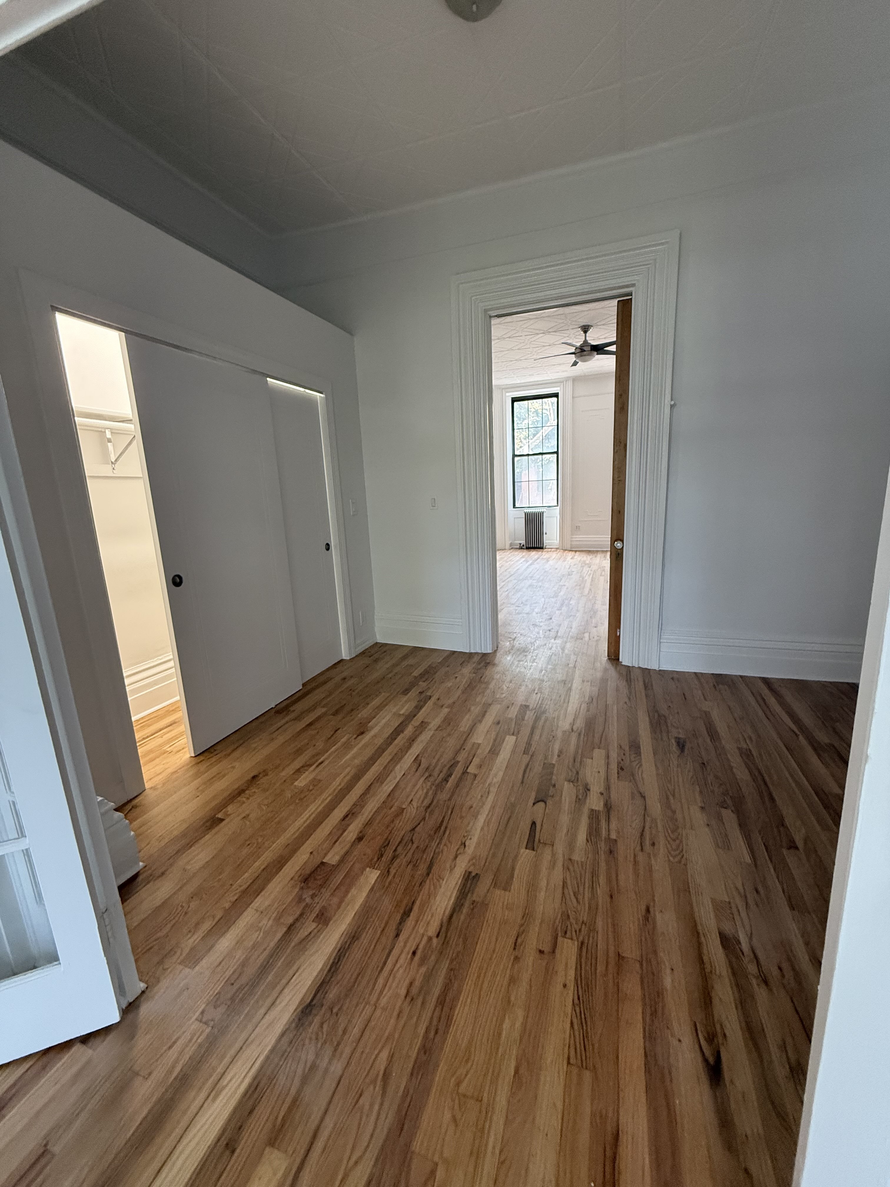 141 Summit Street, Unit 2 Brooklyn, NY 11231 - Photo 5 of 12 a view of a room with wooden floor and window