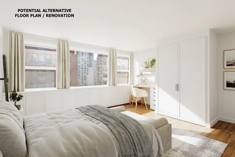 a bedroom with a bed and a large window