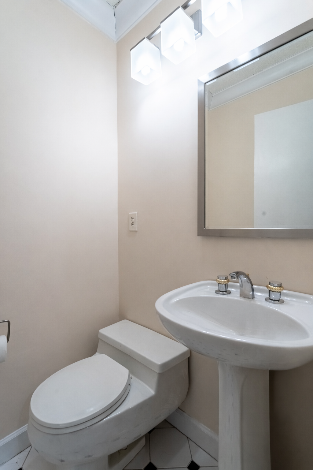 50 East 89th Street, Unit 31C Manhattan, NY 10128 - Photo 13 of 18 a bathroom with a sink a toilet and mirror