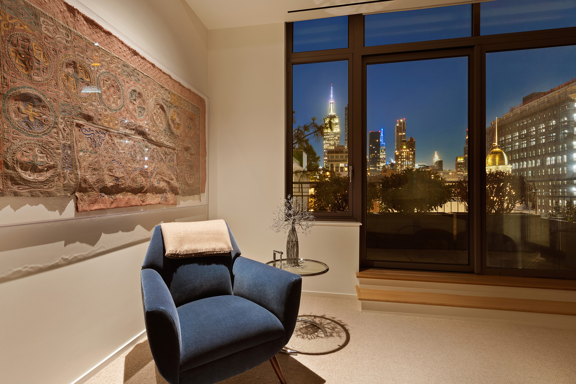 4 West 21st Street, Unit PH Manhattan, NY 10010 - Photo 12 of 14 a living room with furniture and a floor to ceiling window