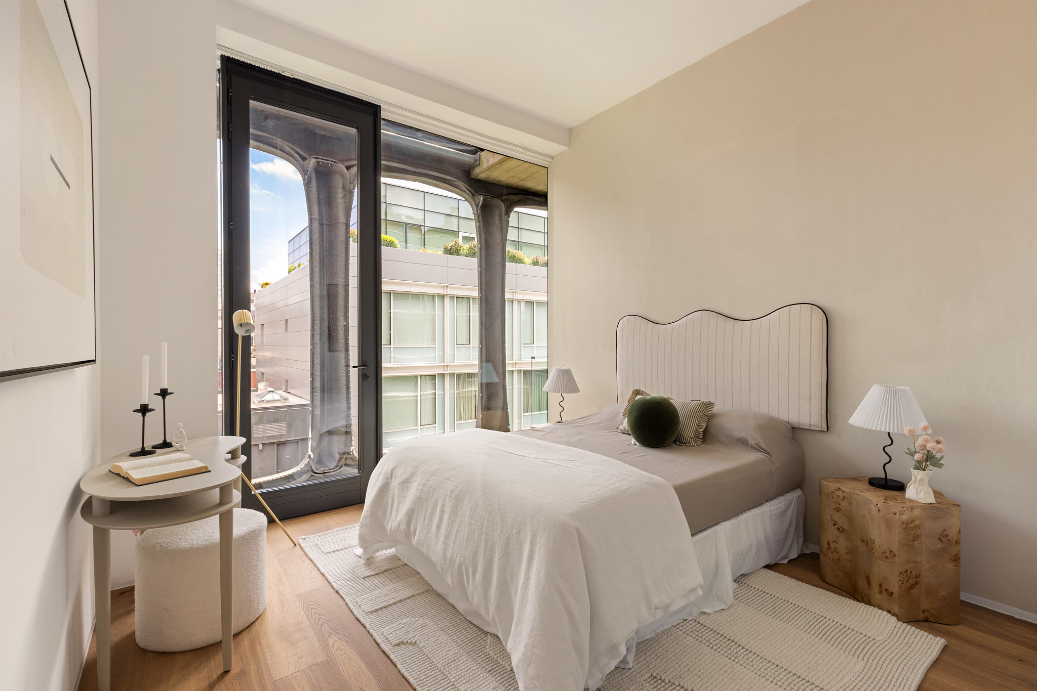 325 West Broadway, Unit 7B Manhattan, NY 10013 - Photo 15 of 21 a bedroom with a bed and a large window