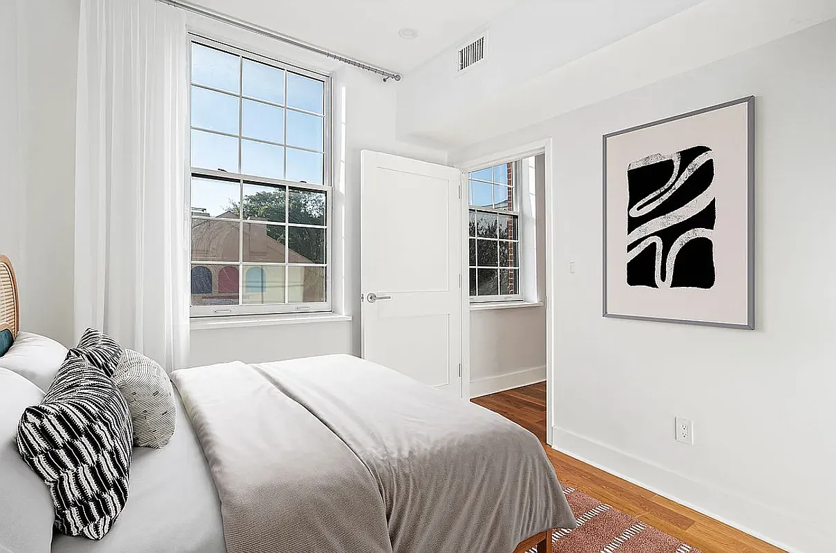 25 Lexington Avenue, Unit 202 Brooklyn, NY 11238 - Photo 3 of 7 a bedroom with a bed and a window
