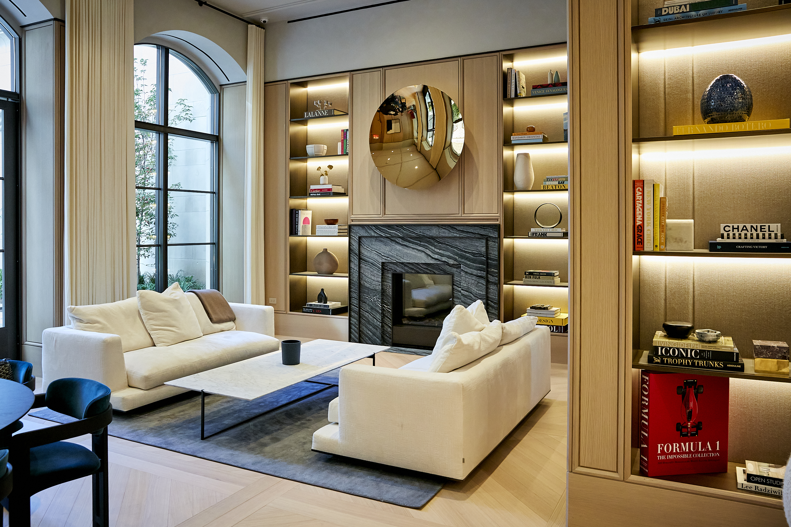 200 East 83rd Street, Unit 34A Manhattan, NY 10028 - Photo 27 of 34 a living room with furniture fireplace and flat screen tv