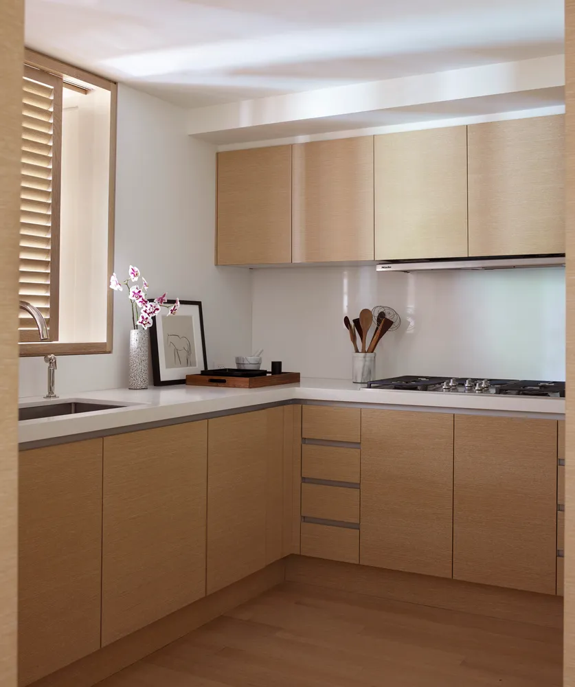 a kitchen with a sink and cabinets