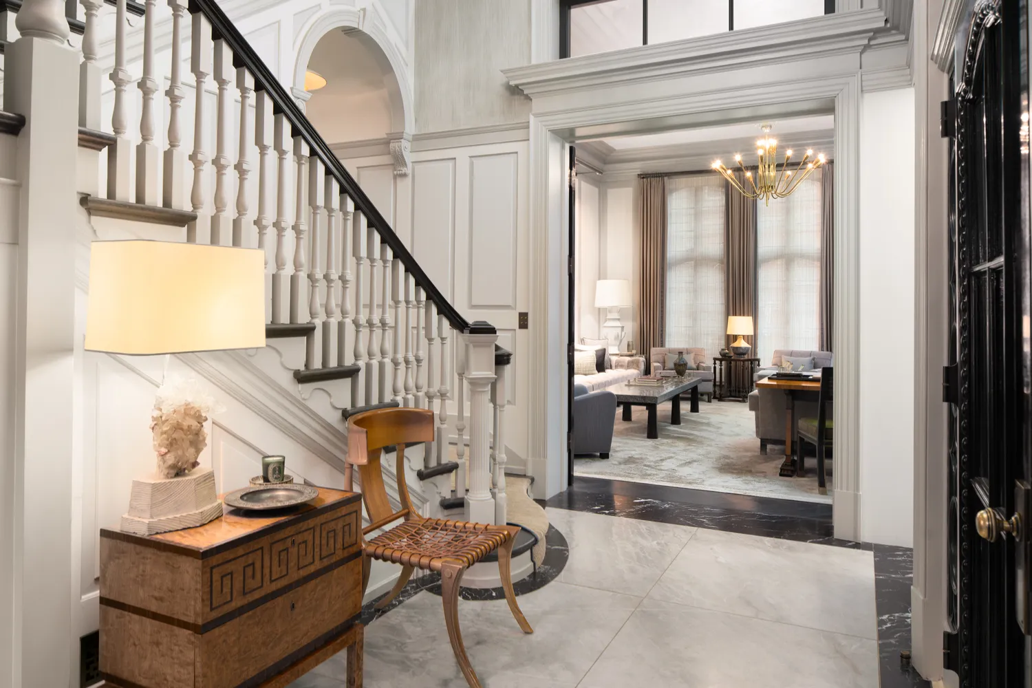 a living room with furniture and a table with wooden floor