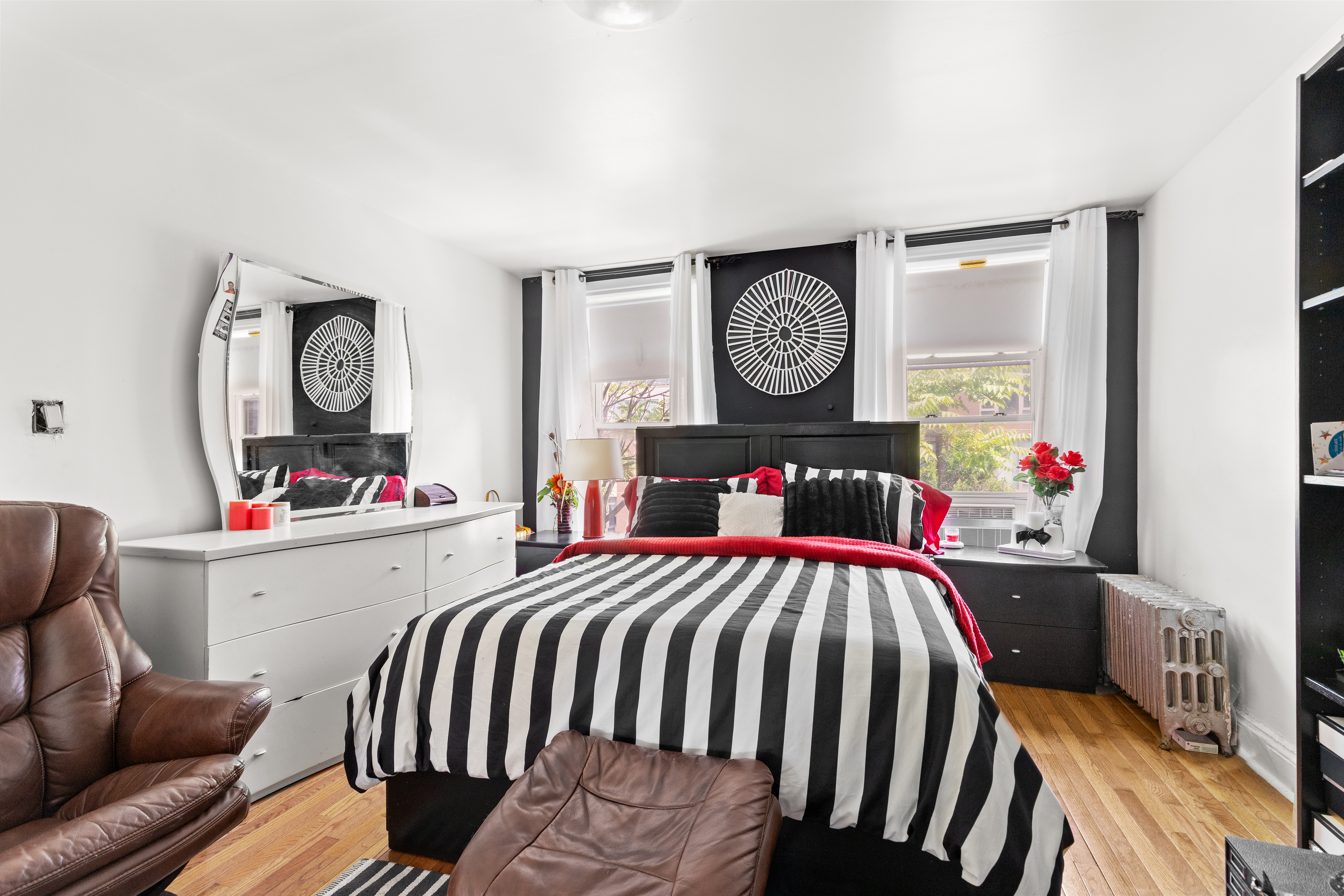 300 Gates Avenue Brooklyn, NY 11216 - Photo 6 of 13 a bedroom with furniture and a bed