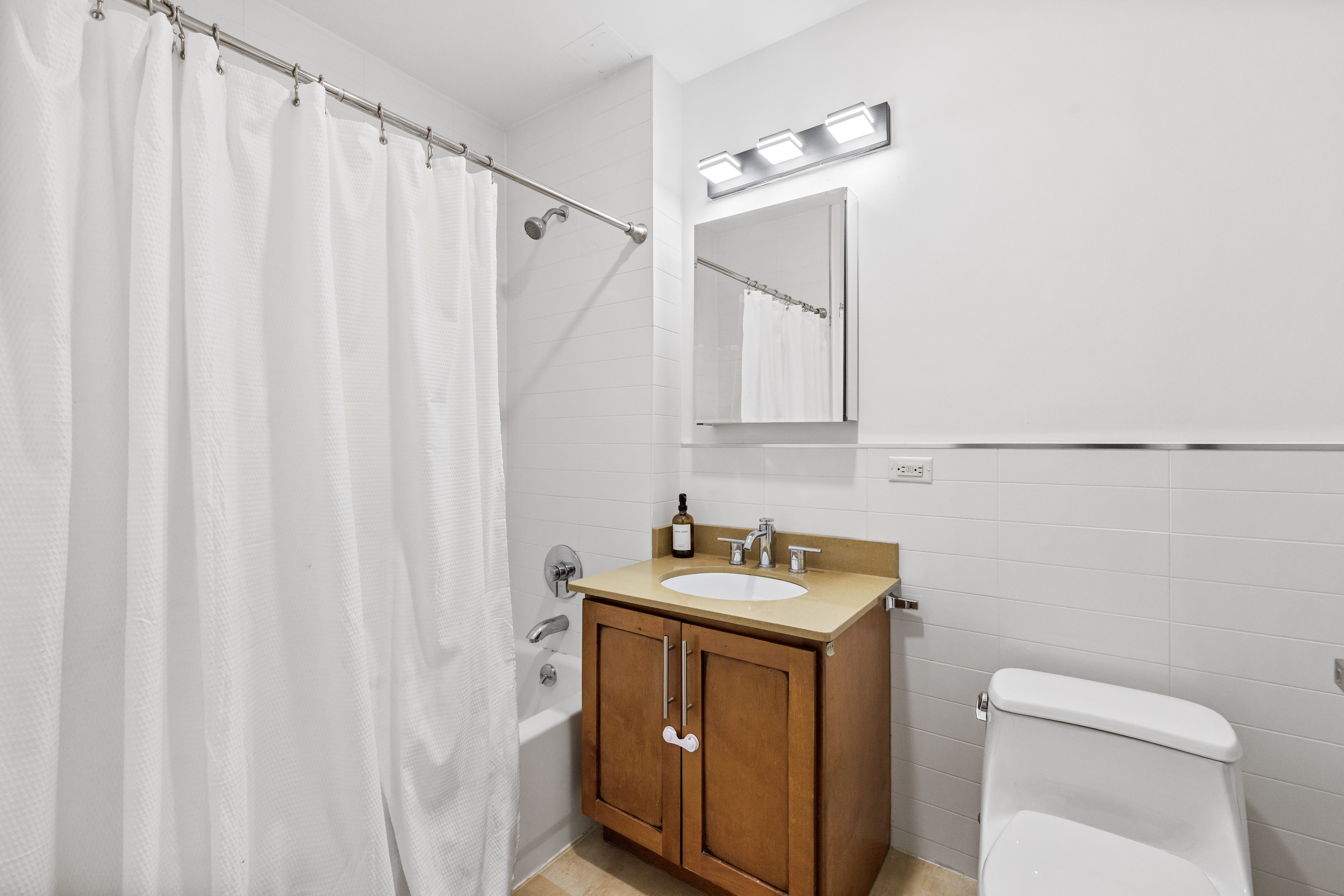 313 West 119th Street, Unit 4E Manhattan, NY 10027 - Photo 7 of 14 a utility room with dryer and washer