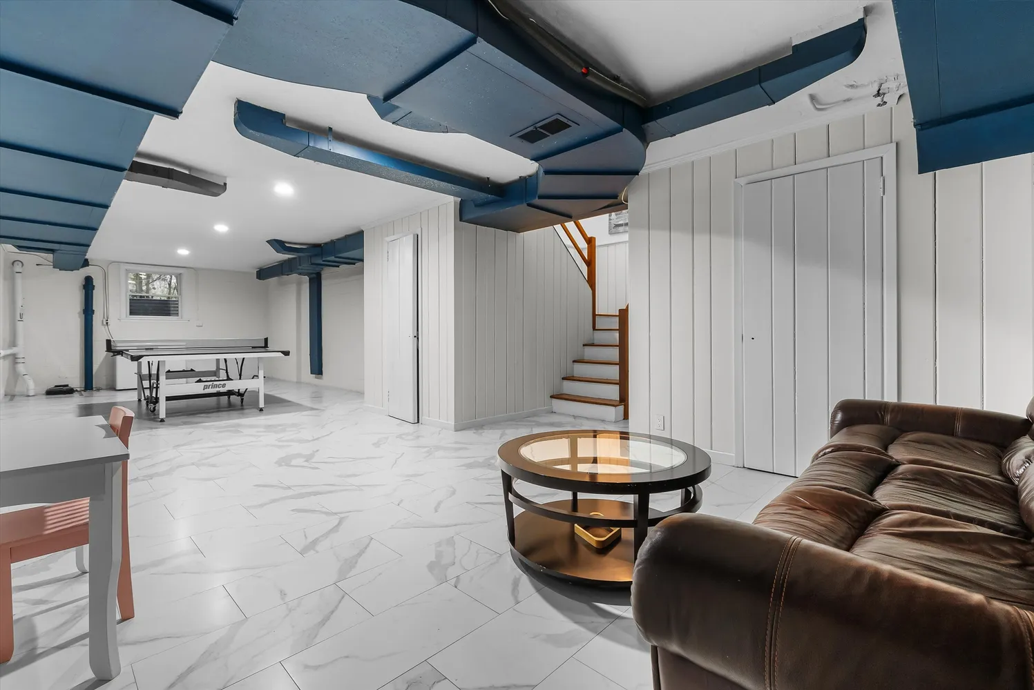 a view of workspace with wooden floor and cabinet