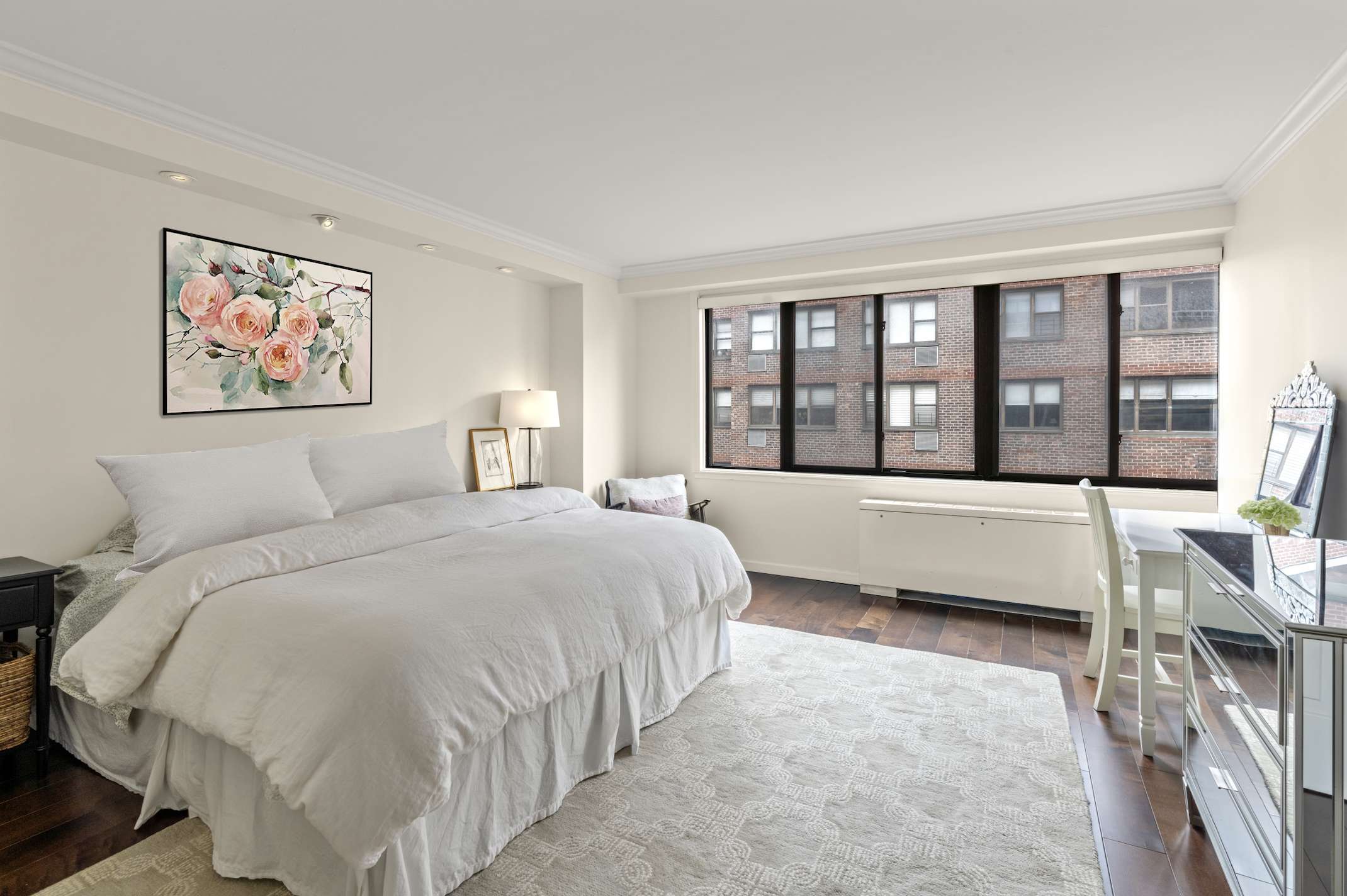 345 East 73rd Street, Unit 11KL Manhattan, NY 10021 - Photo 6 of 12 a bedroom with a large bed and a large window