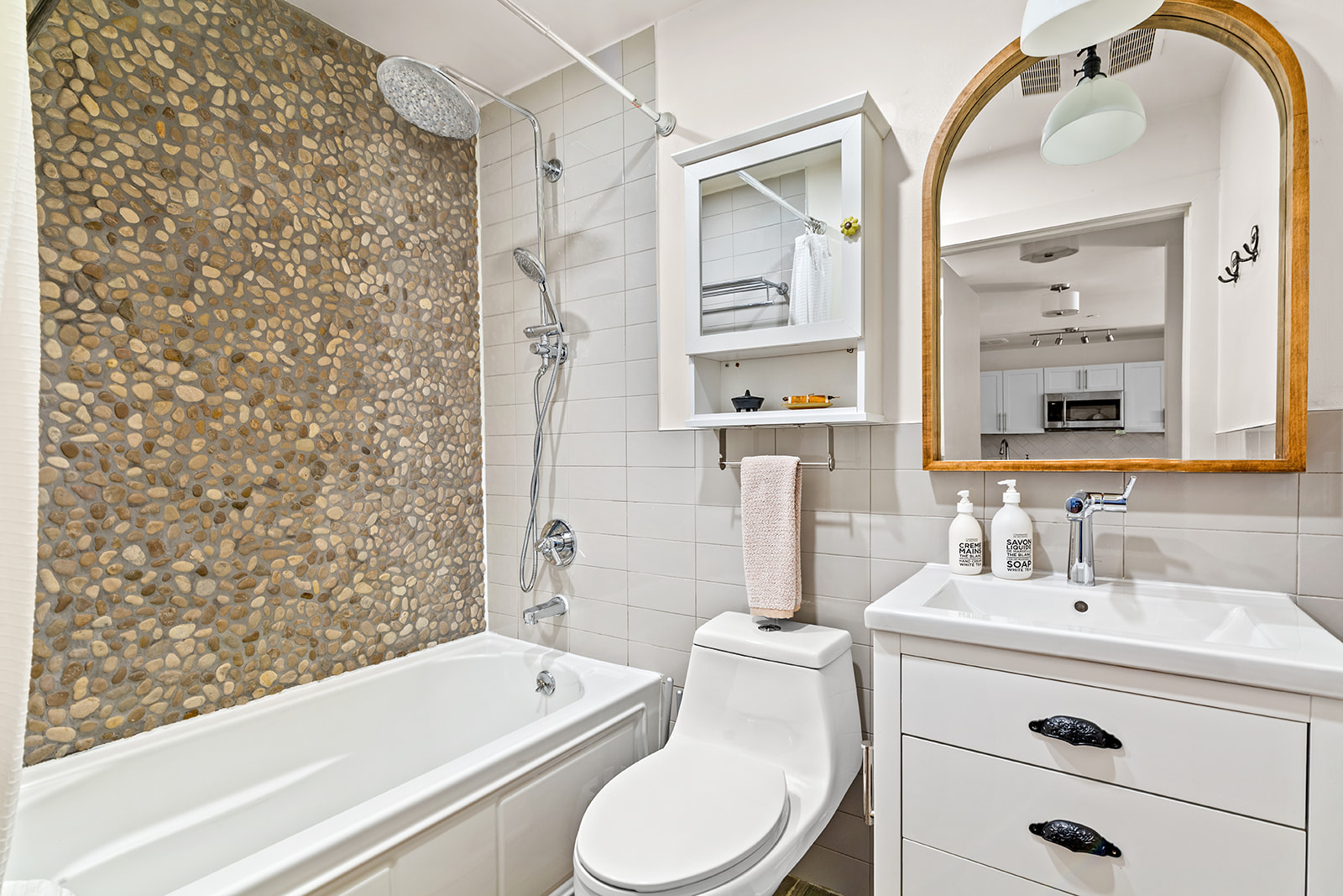 120 Pulaski Street, Unit 1B Brooklyn, NY 11206 - Photo 7 of 13 a bathroom with a sink toilet and shower