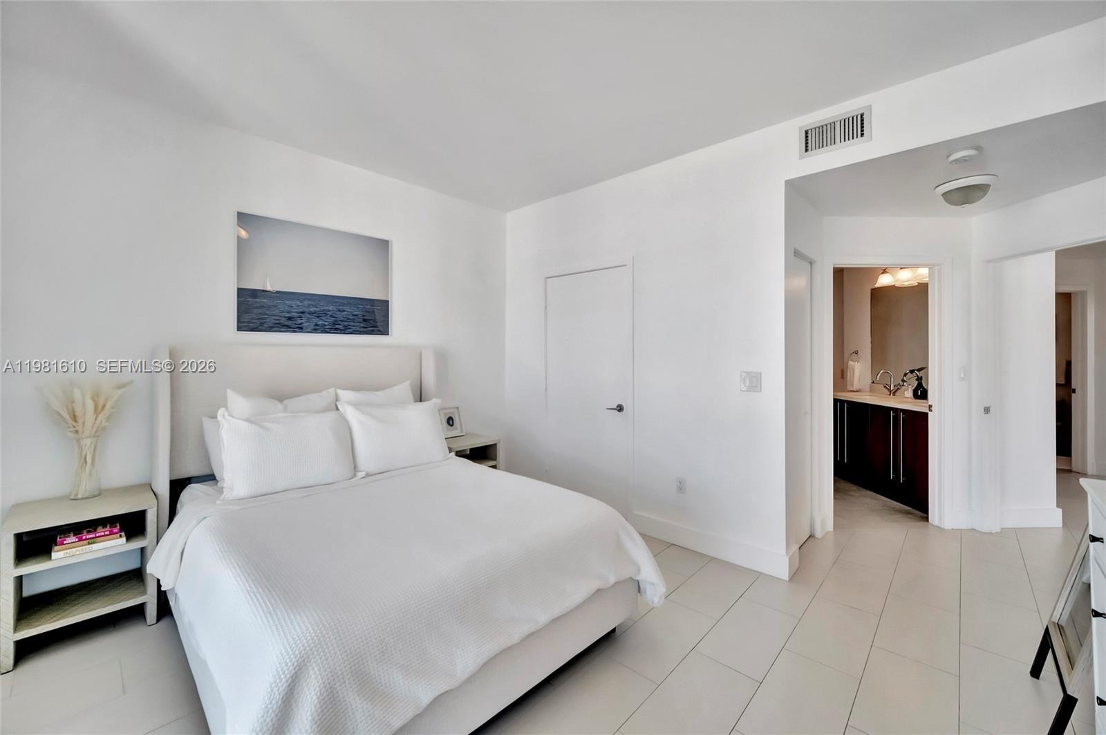 79 Southwest 12th Street, Unit 2201S Miami, FL 33130 - Photo 17 of 33 a bedroom with a bed and a view