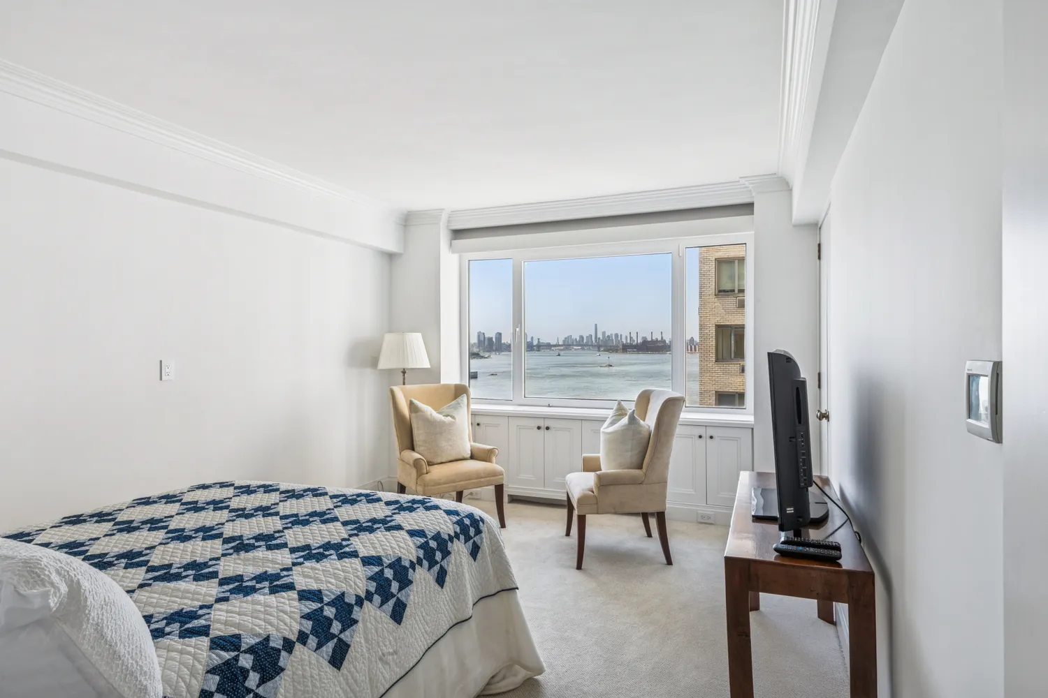 a bedroom with a bed and a table