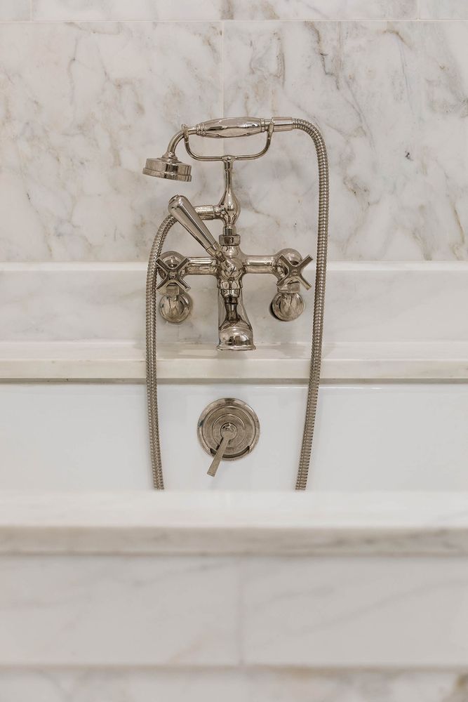 a bathroom with a double vanity sink toilet and shower