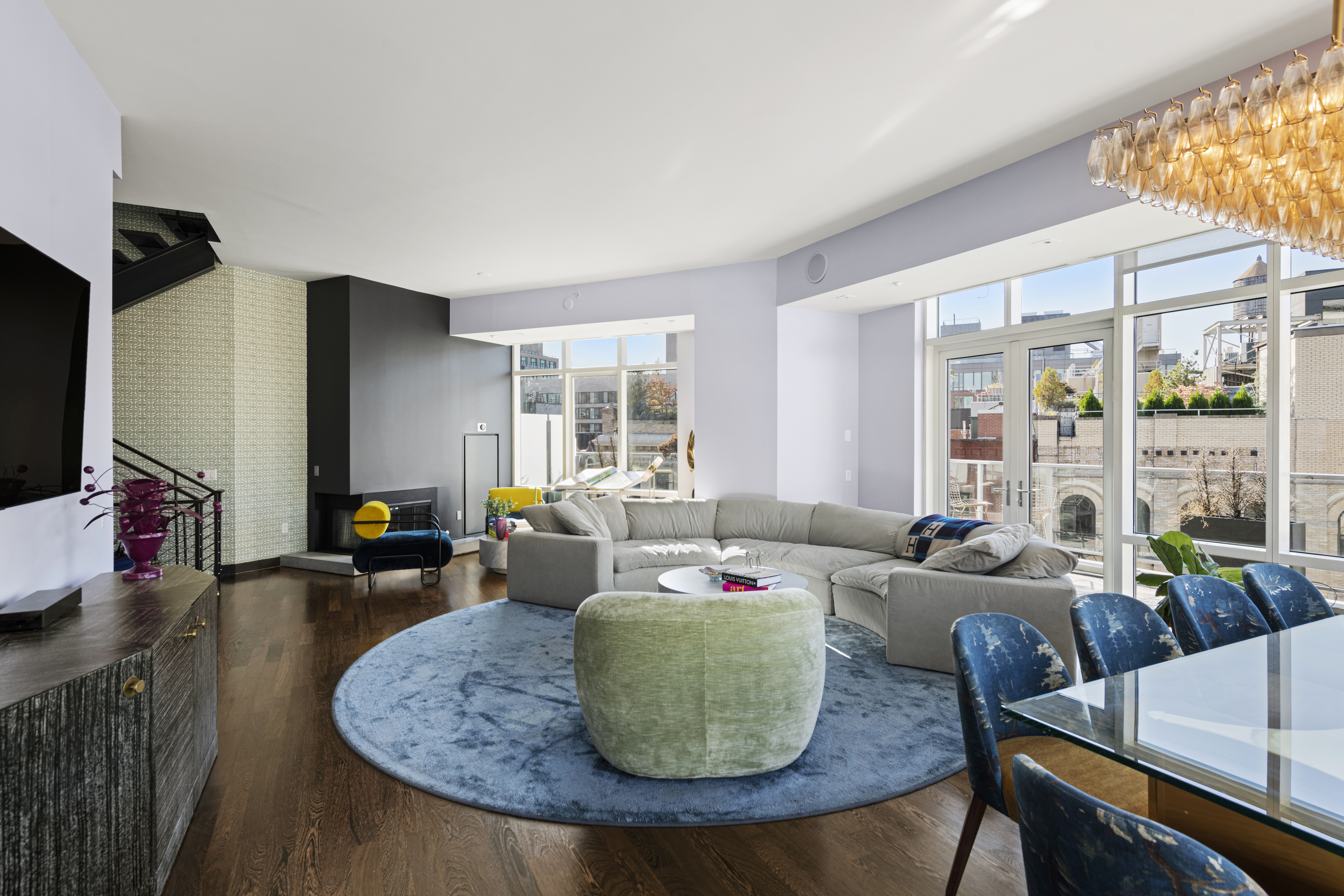 475 Greenwich Street, Unit PHN Manhattan, NY 10013 - Photo 3 of 28 a living room with furniture and a large window