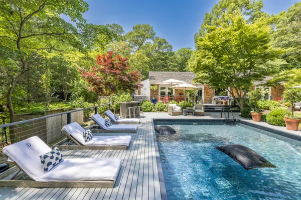 a view of a swimming pool with a patio
