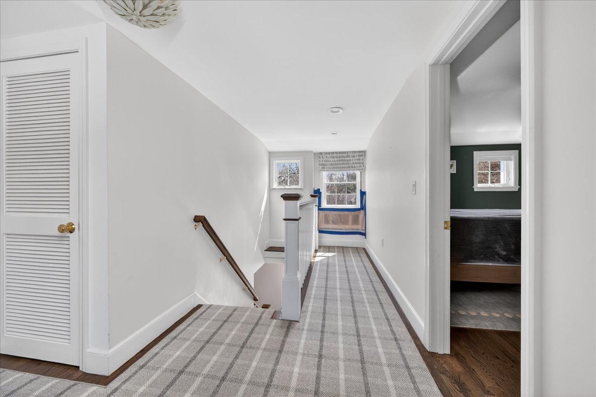6 Studley Road Hingham, MA 02043 - Photo 14 of 27 a view of a hallway with wooden floor and staircase