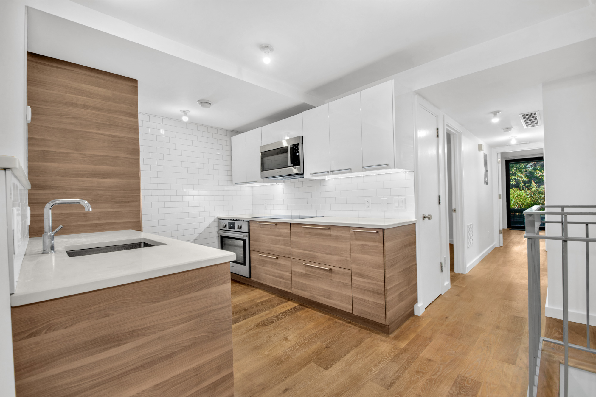 435 Putnam Avenue, Unit GARDEN Brooklyn, NY 11221 - Photo 1 of 11 a kitchen with stainless steel appliances kitchen island granite countertop a stove and a sink