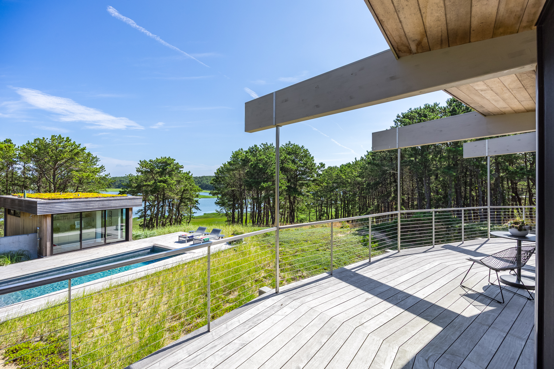 375 King Phillip Road Wellfleet, MA 02667 - Photo 21 of 27 a view of a chairs and table on the wooden deck