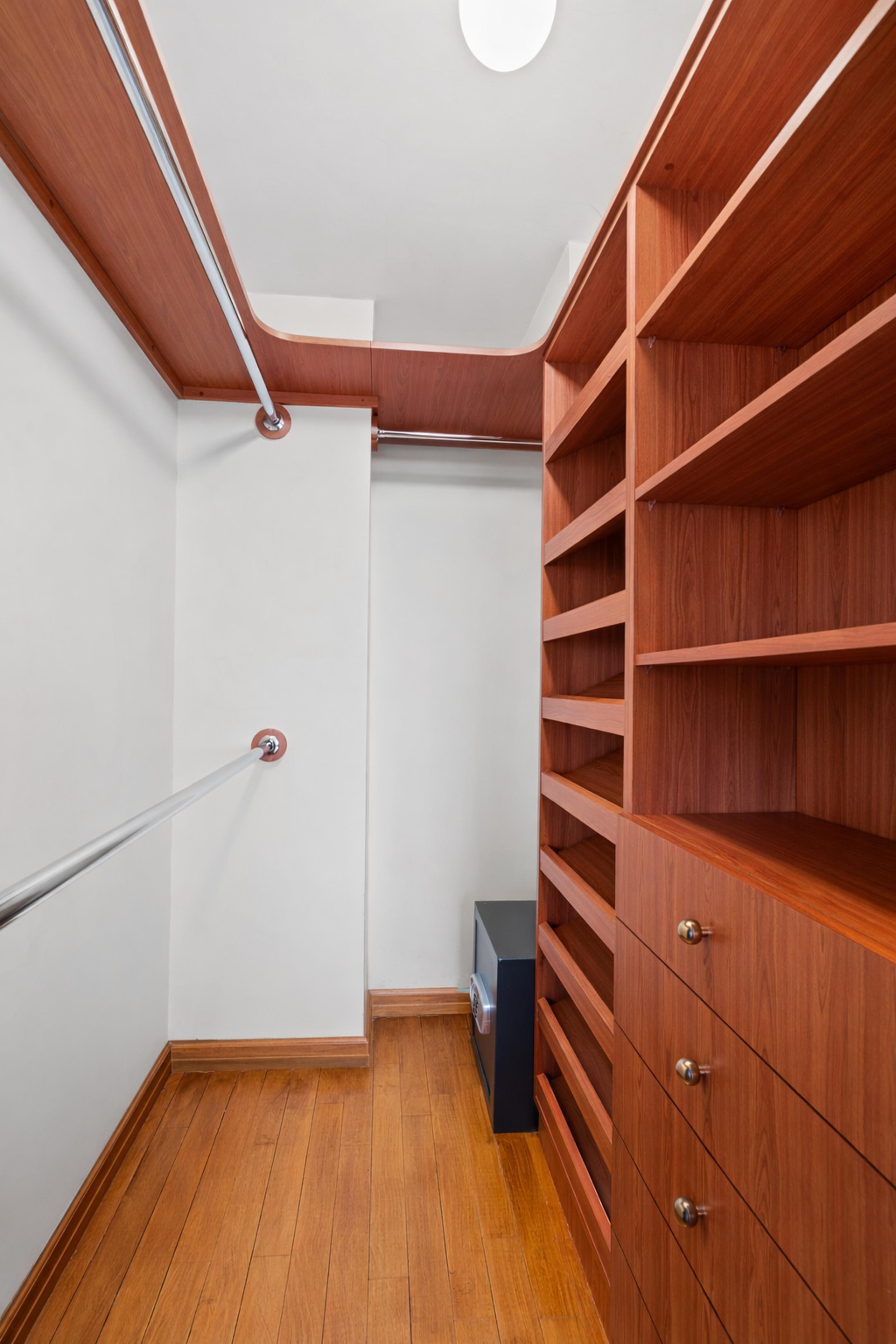 112-01 Queens Boulevard, Unit 17H Queens, NY 11375 - Photo 9 of 26 a view of walk in closet with empty racks