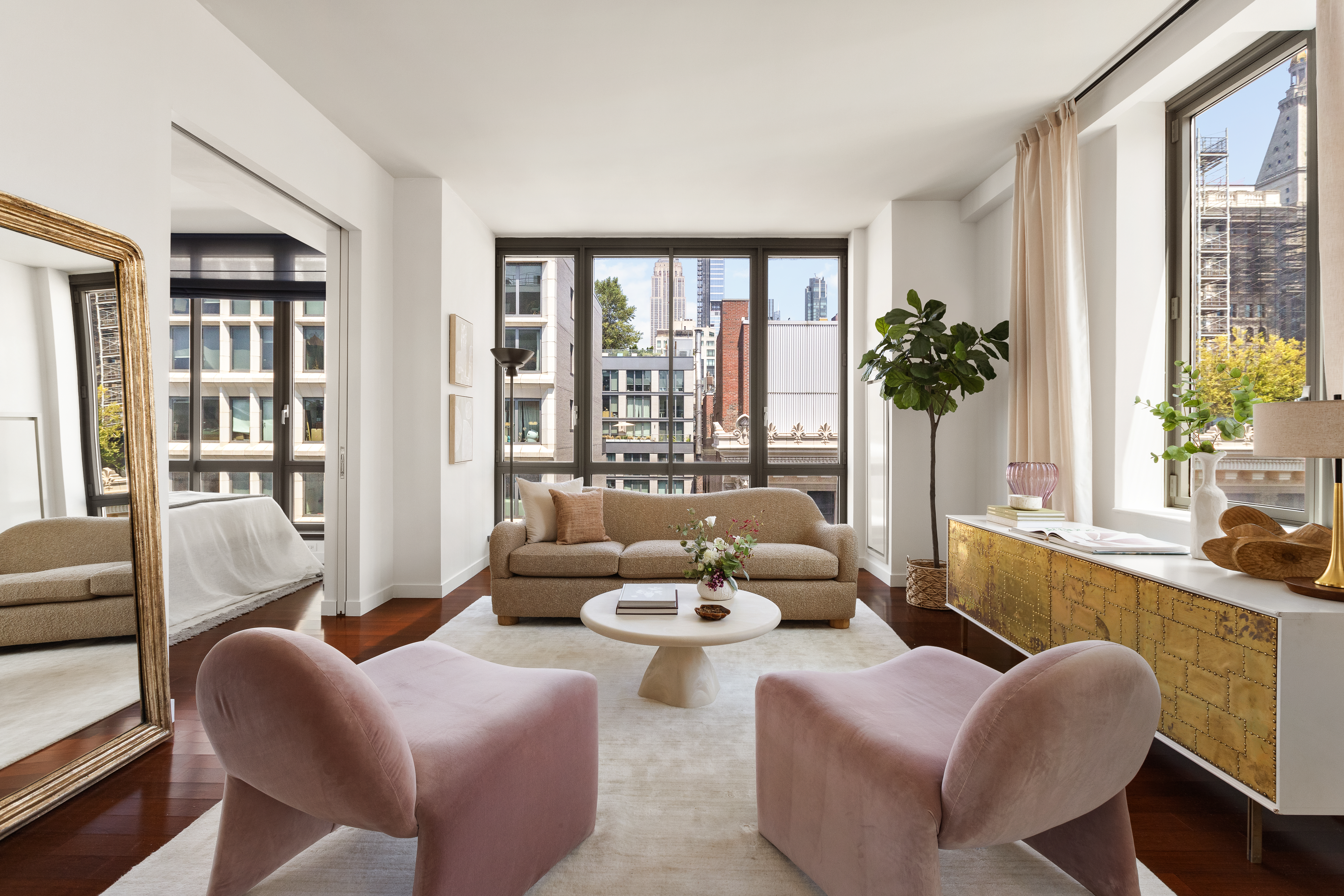 4 West 21st Street, Unit 16A Manhattan, NY 10010 - Photo 1 of 15 a living room with furniture and a potted plant