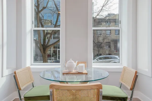 a dining room with furniture and window