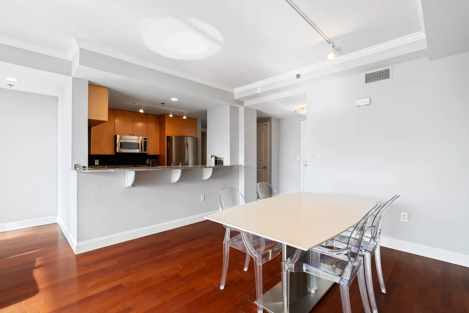 a large bed sitting in a bedroom next to a window