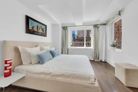 a bedroom with a large bed and a window