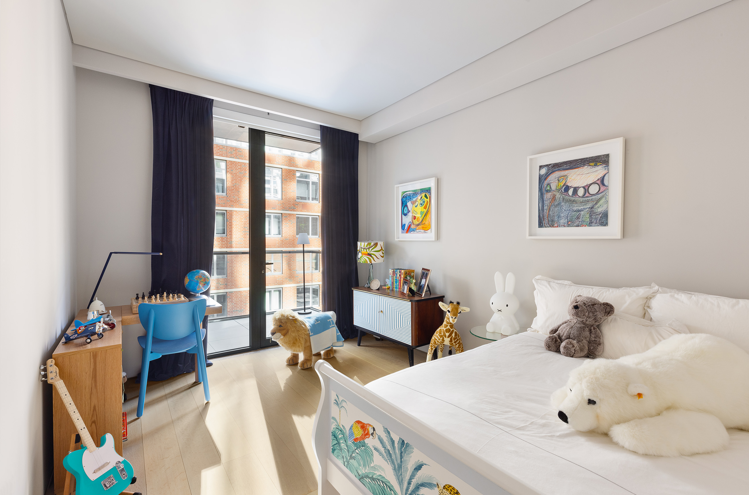 522 West 29th Street, Unit 5D Manhattan, NY 10001 - Photo 10 of 18 a bed room with a bed and a window