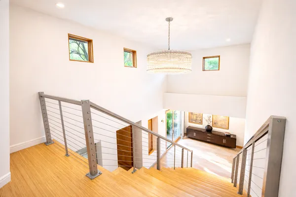 a view of entryway and hall with wooden floor