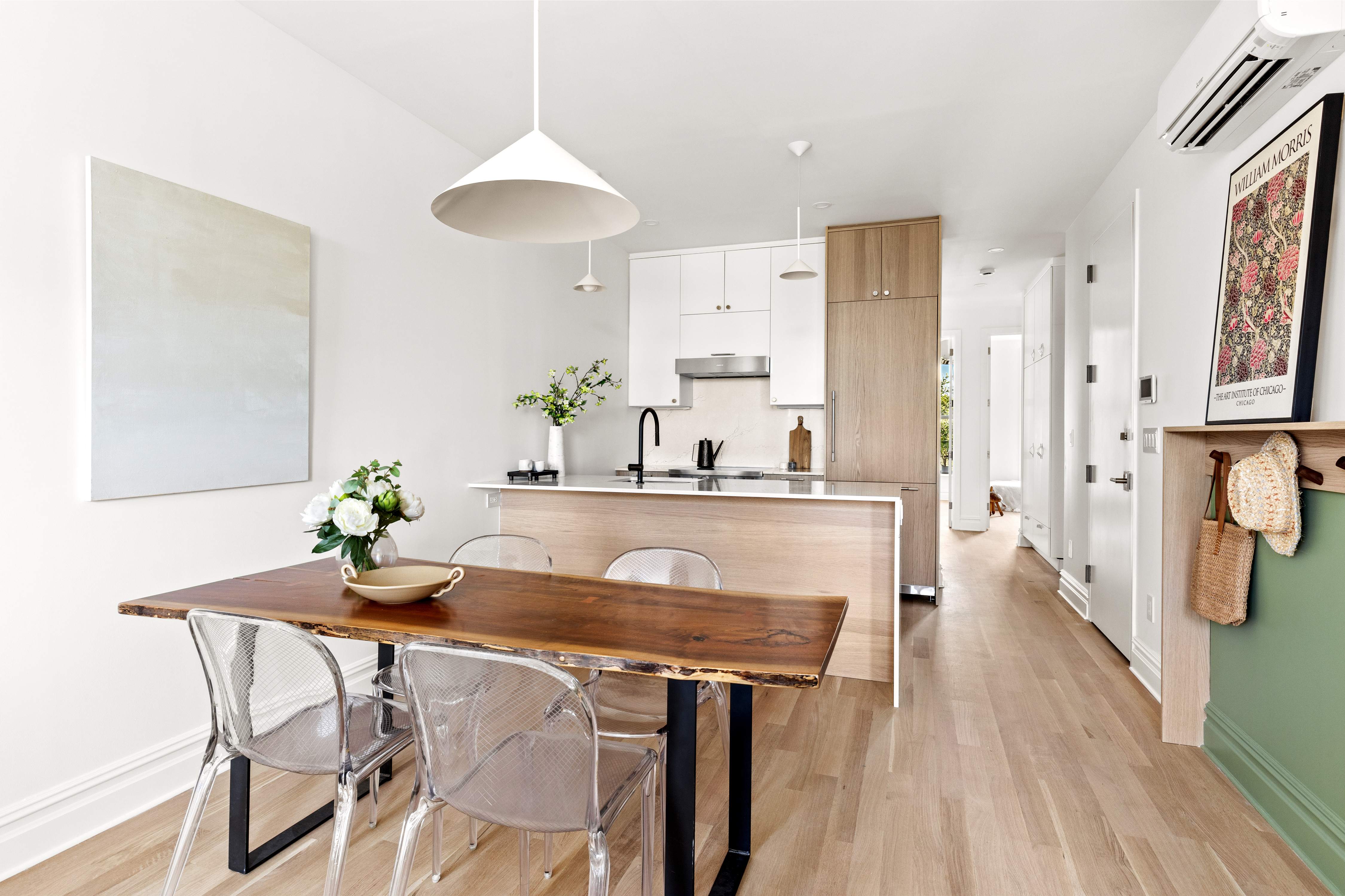 489 7th Avenue, Unit 3 Brooklyn, NY 11215 - Photo 2 of 11 a kitchen with granite countertop white cabinets and stainless steel appliances