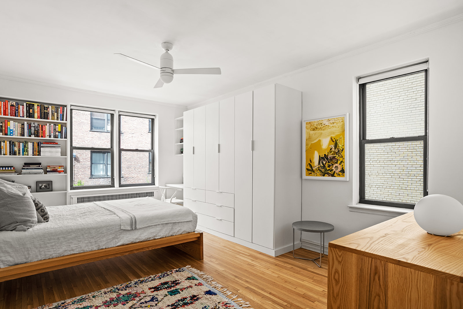 35-36 76th Street, Unit 123 Queens, NY 11372 - Photo 6 of 11 a bedroom with a bed and wooden floor