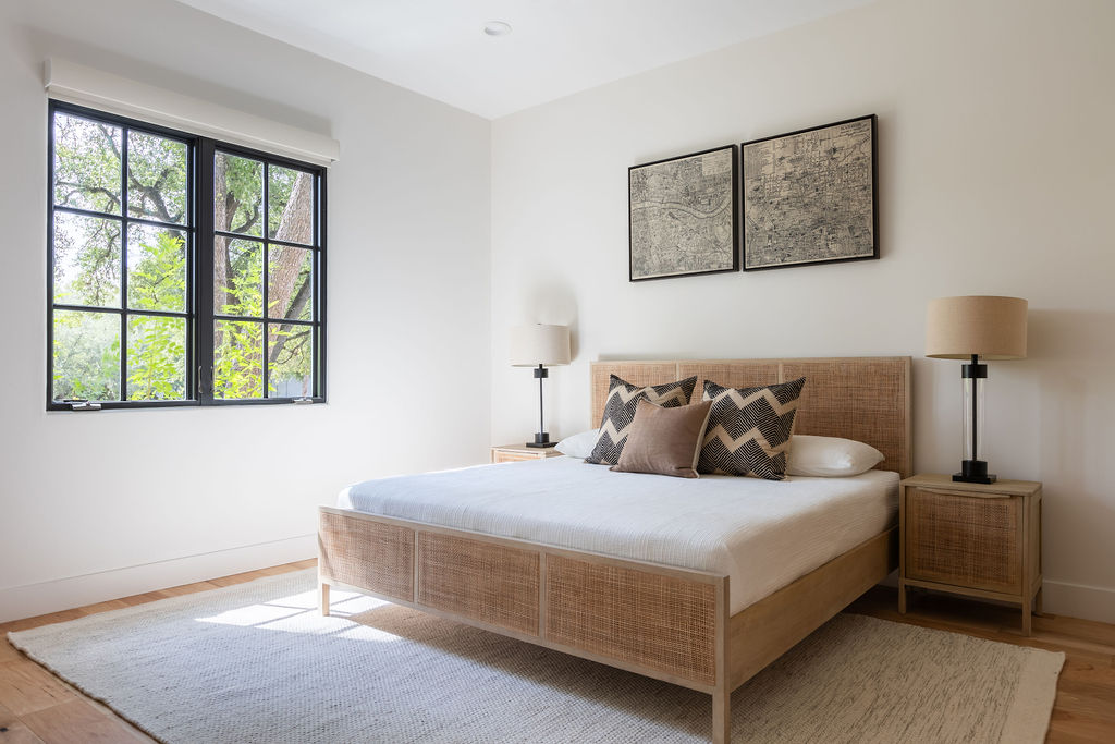 400 Inwood Road Austin, TX 78746 - Photo 22 of 43 a bedroom with a bed and a window