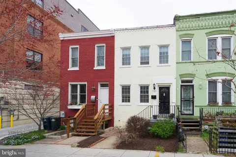 a front view of a building with many windows