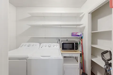 a kitchen with sink cabinets and wooden floor