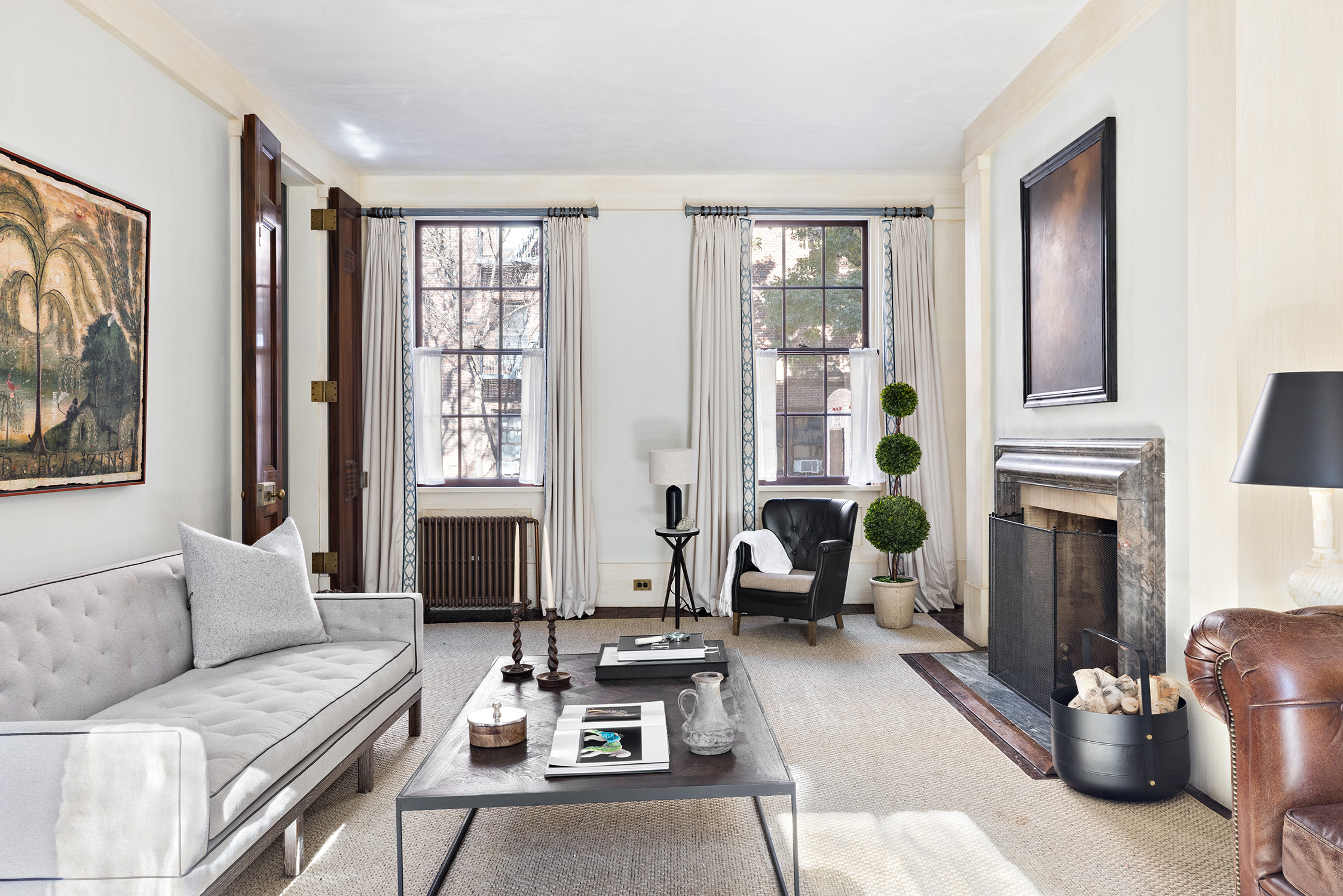68 Morton Street Manhattan, NY 10014 - Photo 2 of 21 a living room with furniture a large window and a fireplace