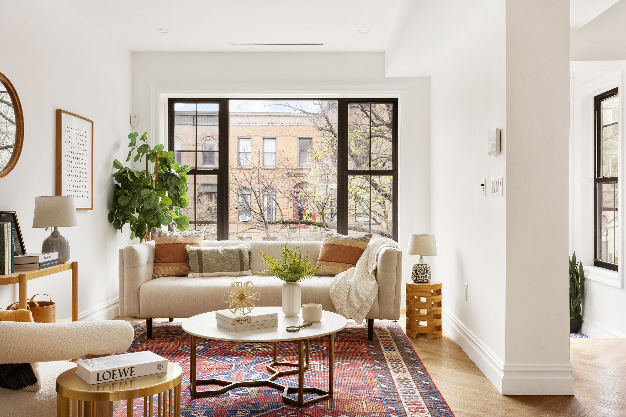 557 Saint Marks Avenue Brooklyn, NY 11216 - Photo 2 of 13 a living room with furniture and a large window