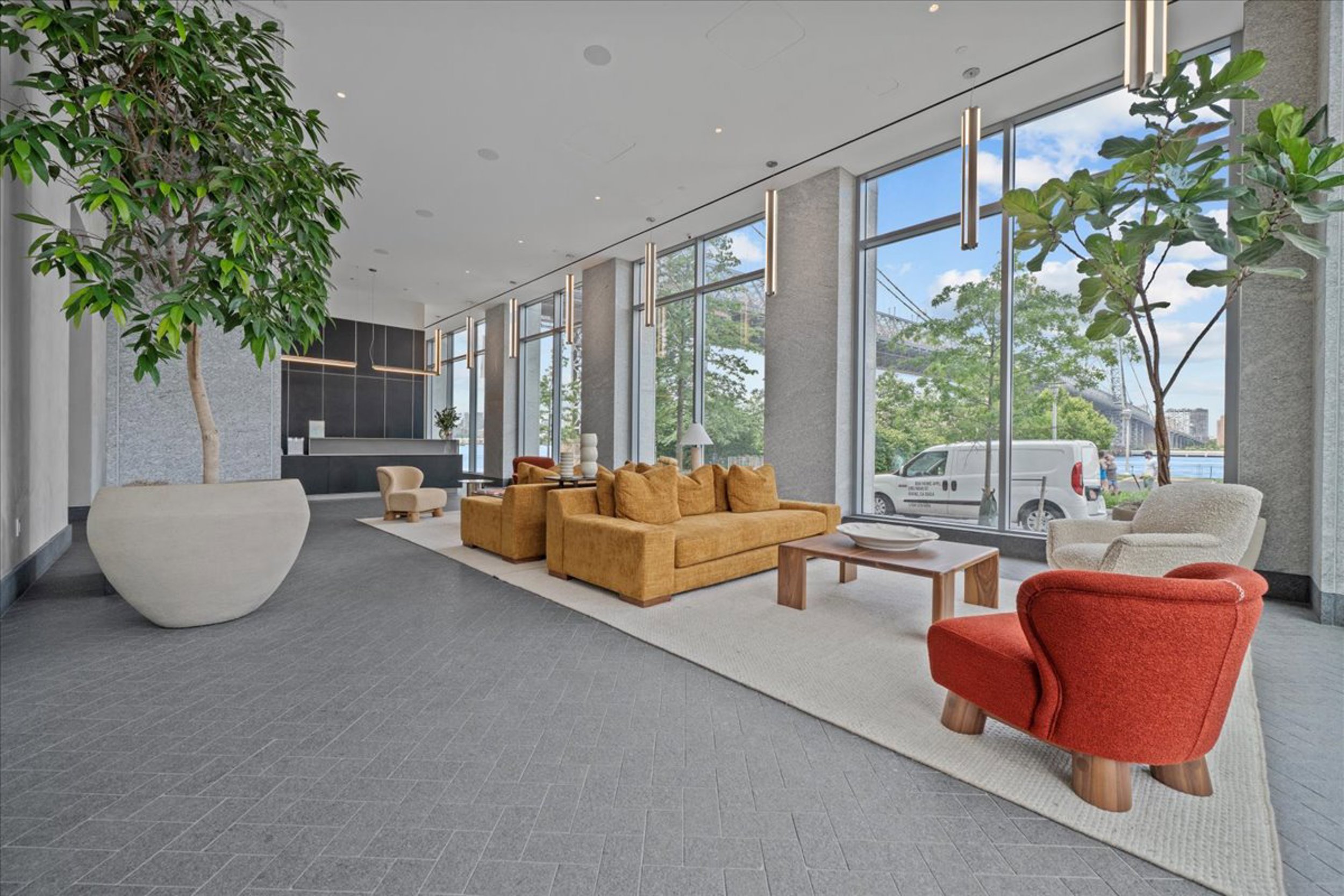 8 South 4th Street, Unit 15D Brooklyn, NY 11249 - Photo 26 of 29 a living room with furniture and a potted plant