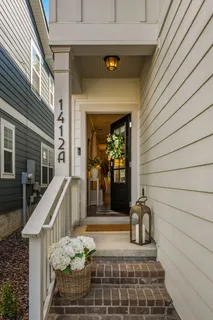 a view of a balcony with furniture