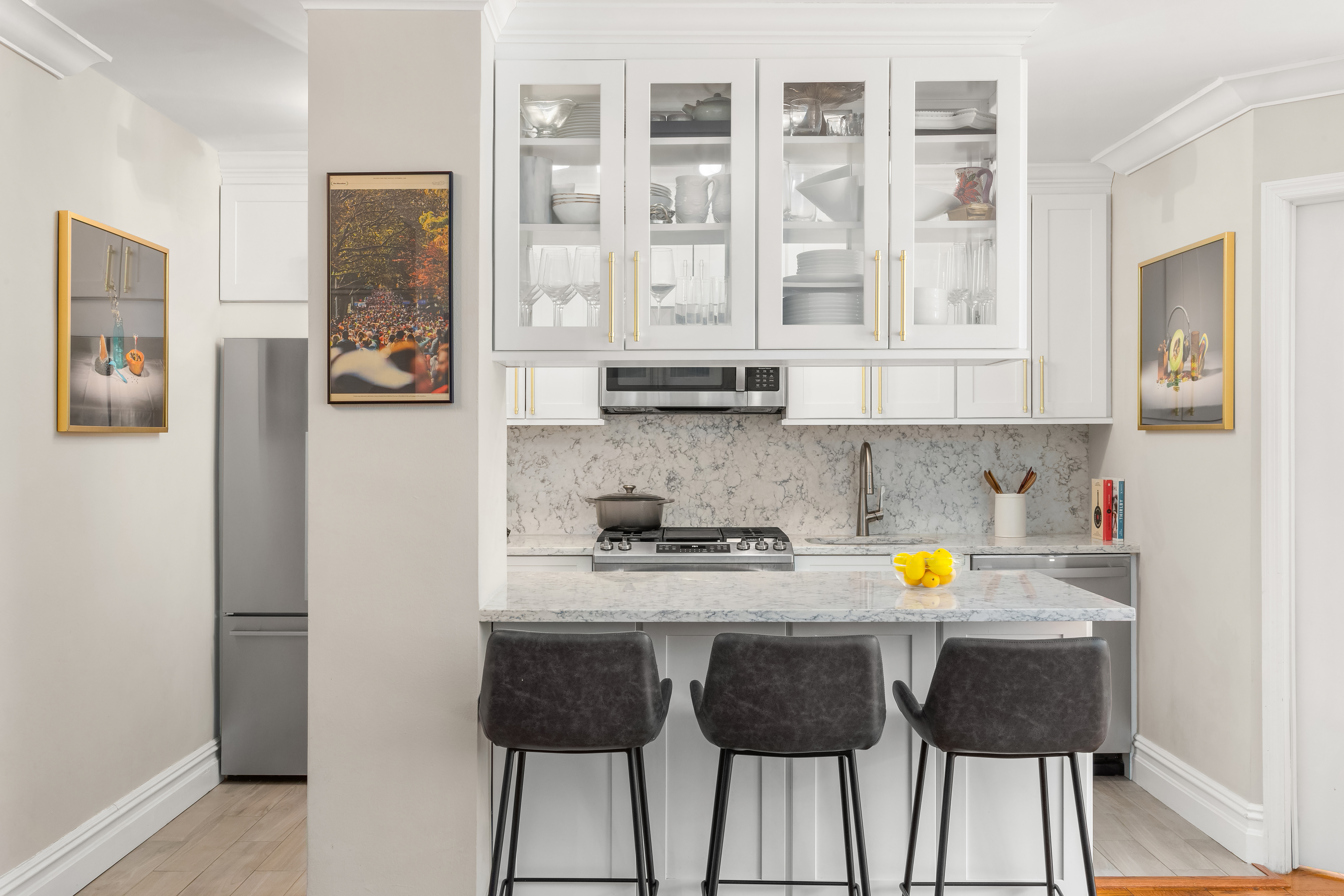 235 East 87th Street, Unit 10B Manhattan, NY 10128 - Photo 5 of 12 a kitchen with a sink and cabinets