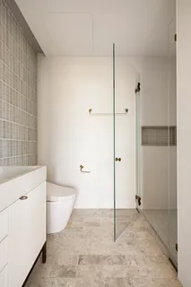 a spacious bathroom with a bathtub and a shower