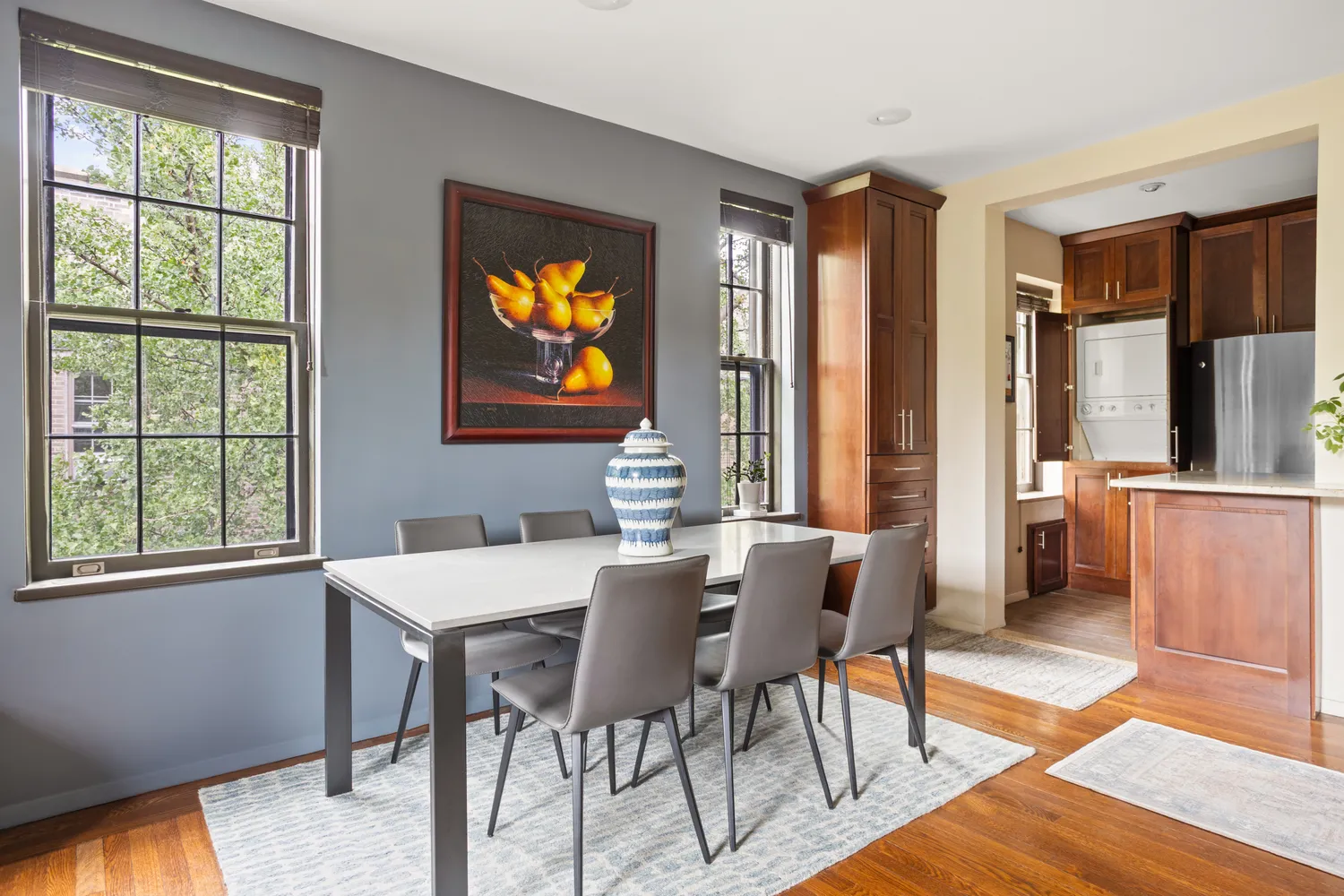 a view of a dining room with furniture and window