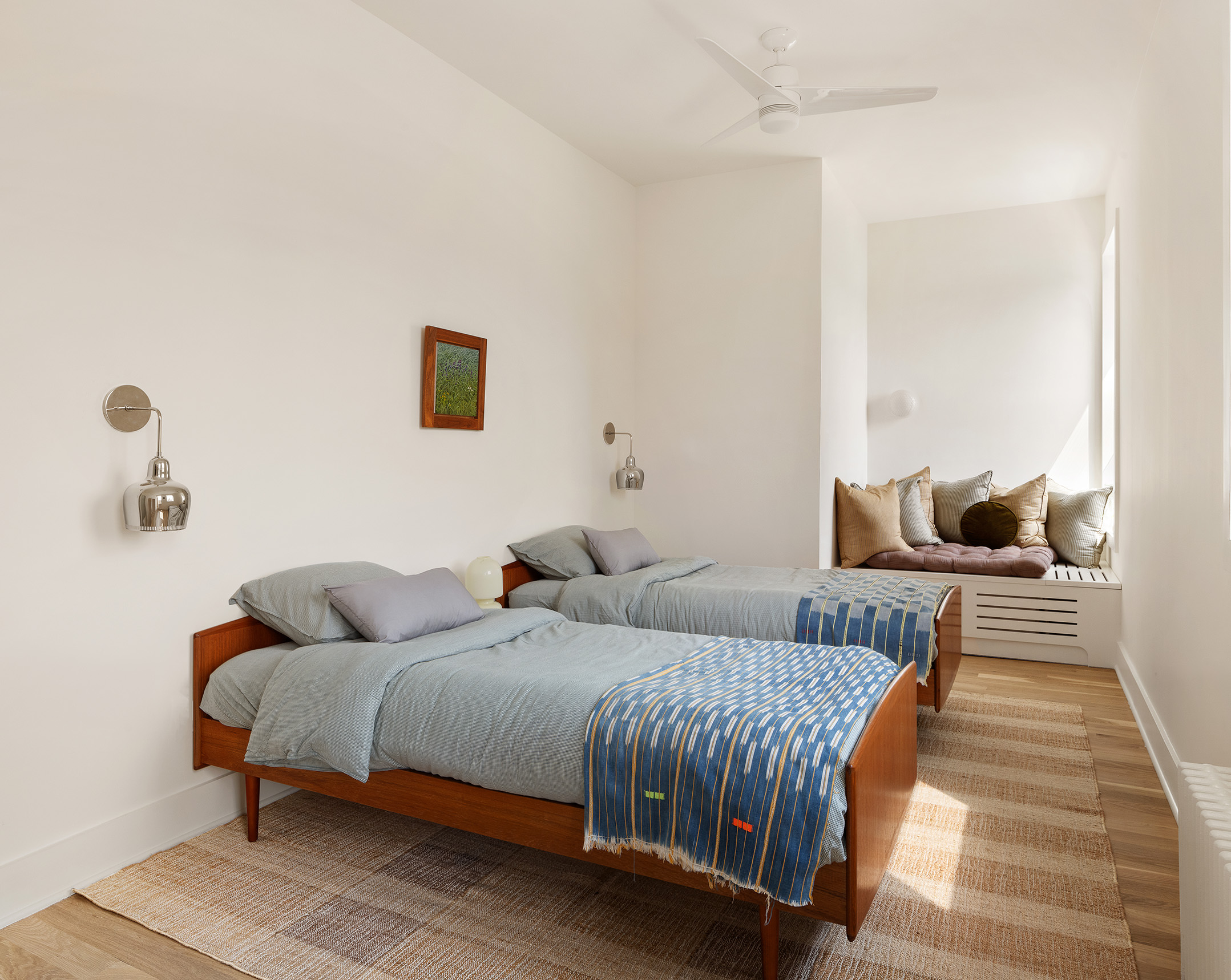 99 Avenue B, Unit PHDE Manhattan, NY 10009 - Photo 13 of 18 a bedroom with a bed and couch