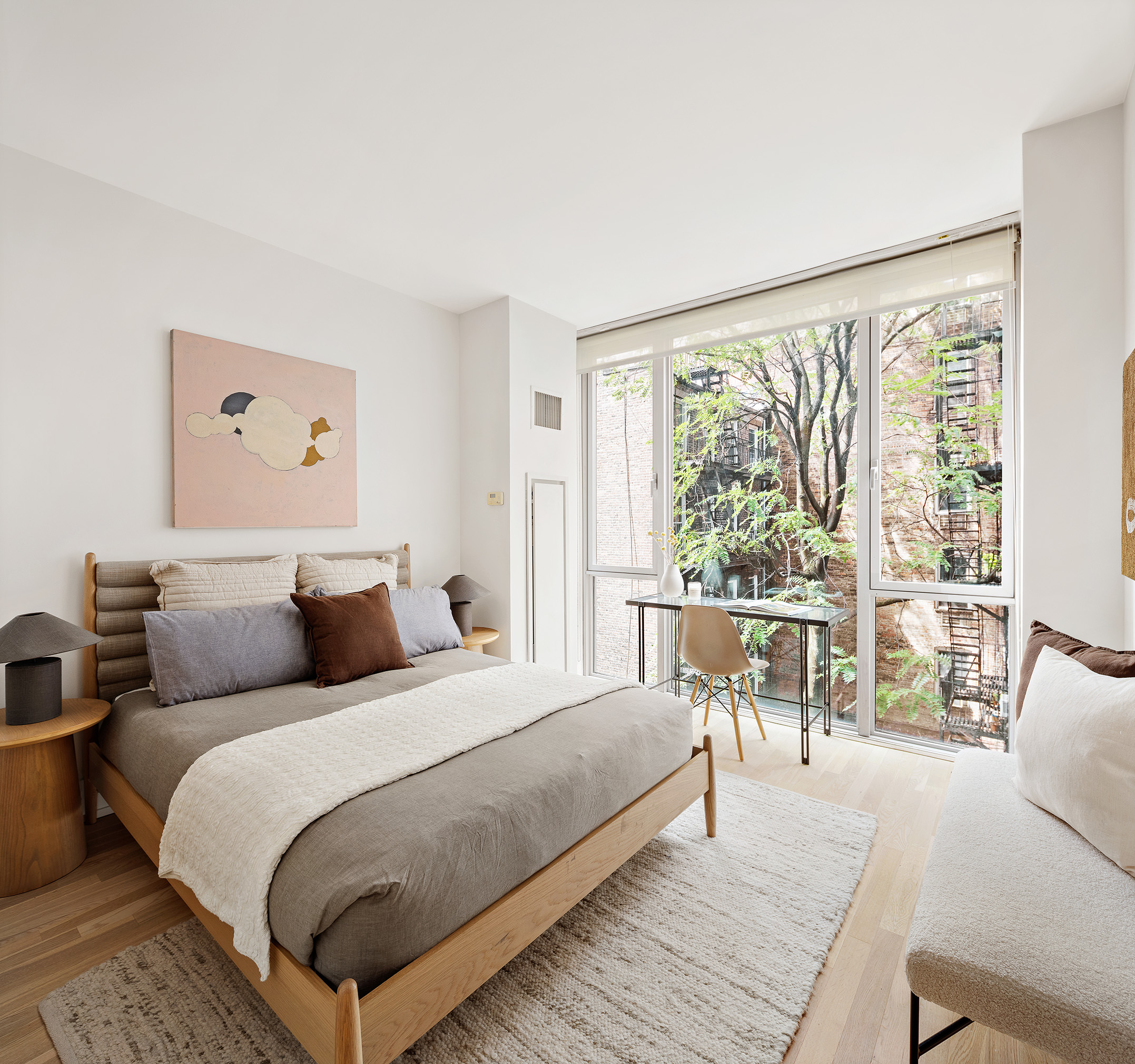 110 3rd Avenue, Unit 4B Manhattan, NY 10003 - Photo 8 of 15 a bedroom with a large bed and a large window