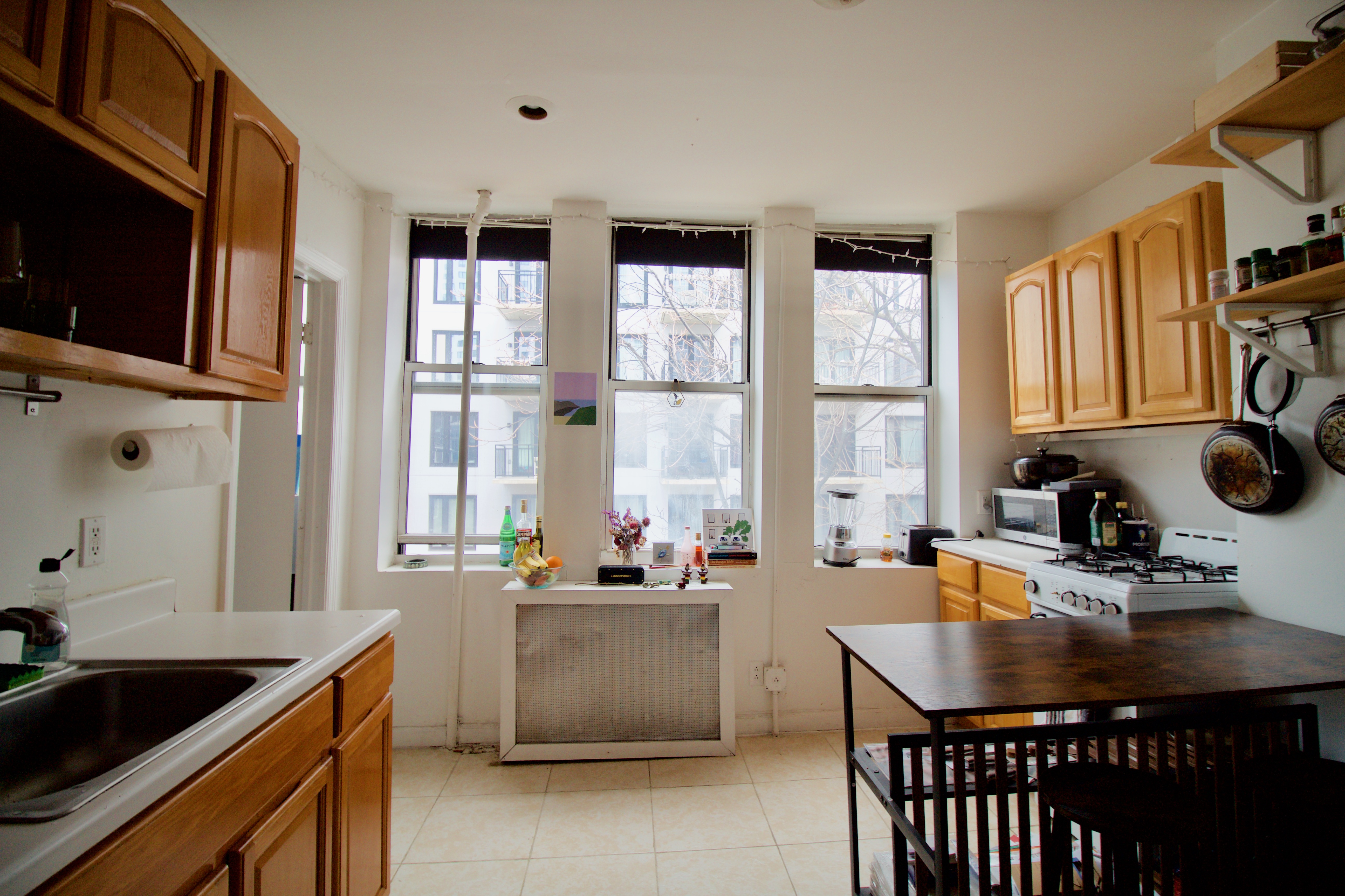 55 Duffield Street, Unit 3 Brooklyn, NY 11201 - Photo 10 of 14 a kitchen with a stove a sink and a microwave