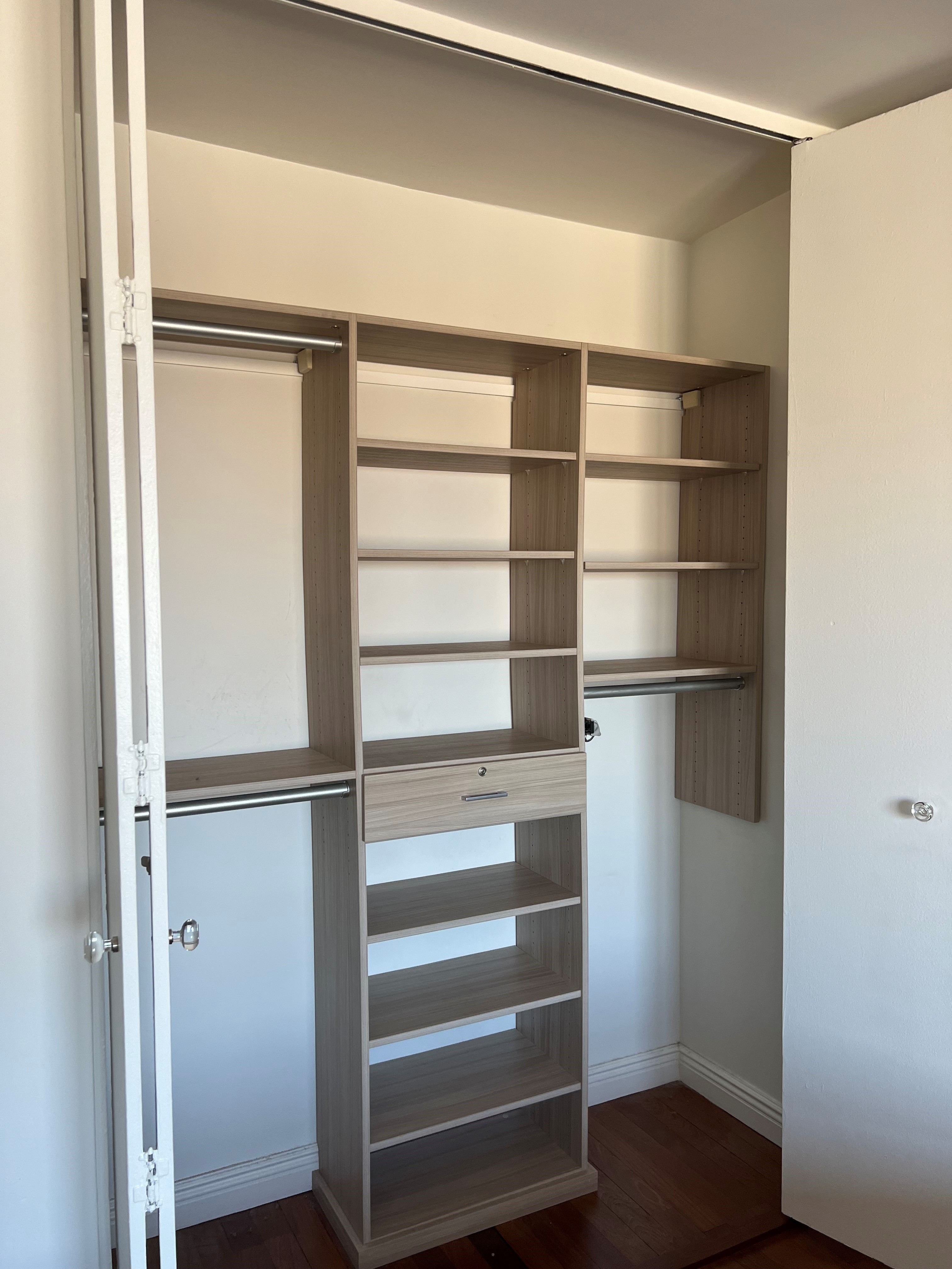 60 East 8th Street, Unit 23D Manhattan, NY 10003 - Photo 7 of 16 a view of walk in closet with empty racks
