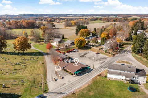 an aerial view of residential houses with outdoor space