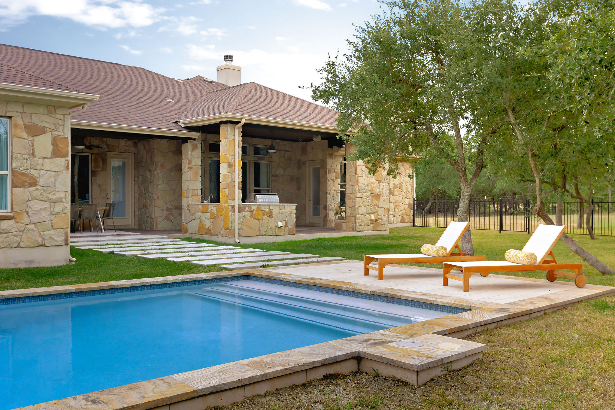 812 Jennings Branch Georgetown, TX 78633 - Photo 89 of 100 a view of swimming pool with lawn chairs and plants